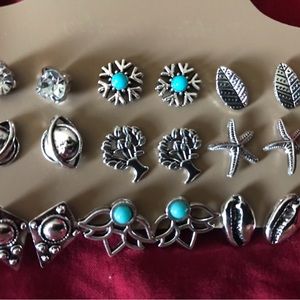 9 pair card of silver tone earrings.